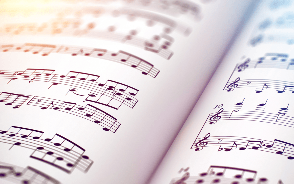 Close up of sheet music on white paper.